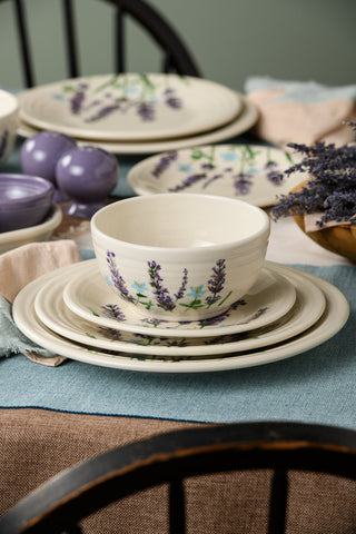 Ivory-colored dinner plate, salad plate, and bowl featuring lavender and small blue flower designs, displayed against a white background.