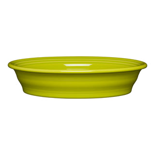 A bright yellow ceramic dish with a wide rim and shallow depth, shown from the side against a white background.