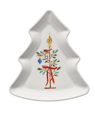 The Retired Holly Berry Christmas Shaped Plate 10 1/8 Inch by Fiesta is a white, tree-shaped lead-safe china plate featuring a painted bird on a decorated branch with ornaments, leaves, a red ribbon, and gold spire.