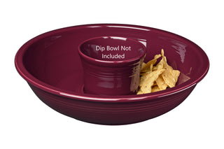 The Fiesta Retired Chip Bowl in claret is a serving platter inspired by Fiesta colors, designed for chips with a center space for your dip bowl (not included). Made from lead-safe china; text reads "Dip Bowl Not Included.