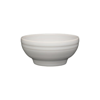 The Fiesta Retired Small 5 1/8 Inch Footed Bowl (14 OZ) in white features a slightly rounded shape with subtle horizontal ridges, displayed against a white background.