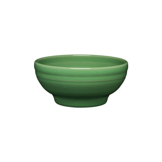 The Fiesta Retired Small 5 1/8 Inch Footed Bowl (14 OZ) in meadow is a green ceramic bowl with a smooth, glossy finish and subtle horizontal ridges. Made in the USA and dishwasher safe, shown on a white background.