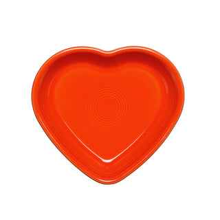 The Retired Fiesta 7 1/2 Inch Medium Heart Shaped Bowl (17 OZ) by Fiesta features a glossy poppy orange finish with concentric circles, made in the USA, and is shown from above on a white background.
