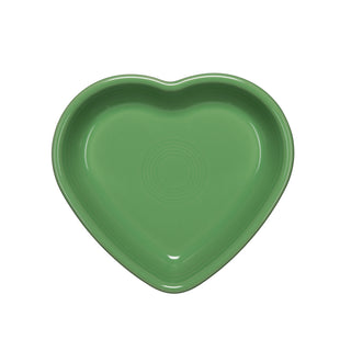 A Fiesta Retired 7 1/2" Medium Heart Shaped Bowl, 17 oz, in meadow green ceramic with a glossy finish and subtle center ridges, is shown from above on a white background. Made in the USA.