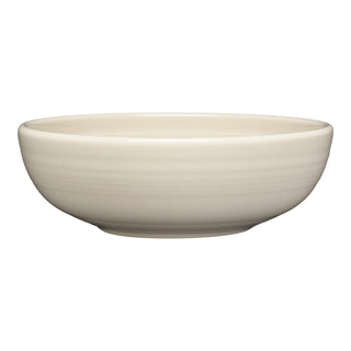 The Fiesta Linen Bistro Coupe 7 5/8 Inch Medium Bowl holds 38 oz and features a smooth, round cream-colored design. Dishwasher, oven, and microwave safe, it's perfect for everyday use. Shown against a white background.
