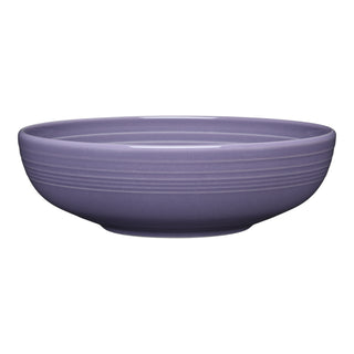 The Fiesta Lavender Bistro Coupe 9 5/8 Inch Large Bowl (68 OZ) features a round, shallow shape and smooth finish with subtle ridges near the rim, making it a perfect ceramic serving bowl, shown here on a white background.