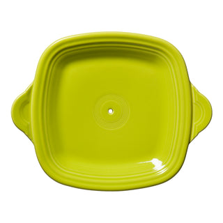 The Fiesta Retired Square Handle Tray W/Hole in Lemongrass is a 13.375" x 10.75" ceramic dish with rounded edges, side handles, and a central hole—ideal for retired items or Tier Hardware, shown from above on a white background.