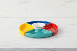 The Fiesta Vibrant 5-Piece Mixed Colors Entertaining Set (8 1/5") includes four colorful wedge trays—yellow, teal, red, blue—around a white center bowl, creating a lively serving piece perfect for snacks on any occasion.