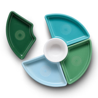 The Fiesta Aegean 5-Piece Mixed Colors Entertaining Set features four wedge-shaped plates in vibrant hues circling a central white bowl; one dark green plate stands slightly apart for a stylish touch at any gathering.