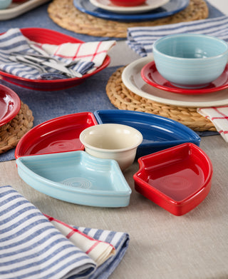 The Fiesta Americana 5-Piece Mixed Colors Entertaining Set (8 1/5 inch) features colorful ceramic trays and a cream dip bowl, displayed with striped napkins and woven placemats—perfect for gatherings and entertaining.