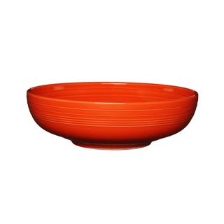 The Fiesta Retired Bistro Coupe 10 1/2 Inch Extra Large Bowl (96 OZ) in Poppy features a smooth, glossy ceramic finish with subtle horizontal grooves. Made in the USA and shown against a white background.