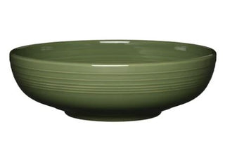 The Fiesta Retired Bistro Coupe 10 1/2 Inch Extra Large Bowl, 96 oz in Sage, is a round, shallow vitrified china bowl with a smooth finish and subtle horizontal ridges, and is dishwasher safe for easy cleaning.