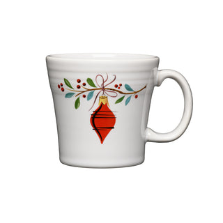 The Fiesta Retired Holly Berry Christmas 15 OZ Tapered Mug features a red ornament with green leaves and red berries on white, crafted from lead-safe china.