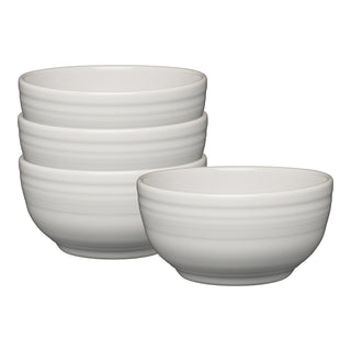 The Fiesta White Bistro Coupe 5 1/2 Inch Cereal Bowl set includes four 22 oz ceramic bowls with a smooth, subtly lined design. Dishwasher safe, these white bowls are perfect for everyday use.
