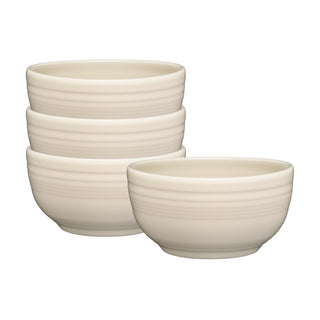 The Fiesta Linen Bistro Coupe 5 1/2 Inch Cereal Bowl set includes four 22 oz cream-colored bowls with a smooth, slightly ribbed texture—perfect for breakfast or entertaining.