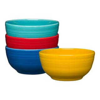 The Fiesta Mixed Vibrant Bistro Coupe 5 1/2 Inch Cereal Bowl set includes four 22 oz dishwasher-safe bowls in turquoise, red, blue, and yellow, all with a glossy finish, shown stacked together on a white background.
