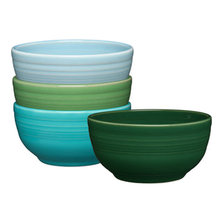 The Fiesta Mixed Aegean Bistro Coupe 5 1/2 Inch Cereal Bowl Set includes four 22 oz bowls in light blue, light green, turquoise, and dark green, each with a simple round shape and subtle horizontal ridges.