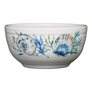 The Fiesta Retired Coastal Shores Bistro Coupe 5 1/2 Inch Cereal Bowl (22 oz) is a white vitrified china bowl made in the USA, featuring blue, teal, and gold sea shell and seaweed designs along the side.