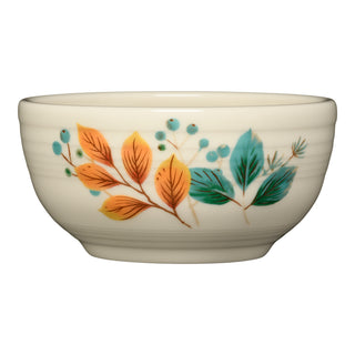 The Fiesta Autumn Fields Bistro Coupe 5 1/2 Inch Cereal Bowl (22 oz) features cream-colored vitrified china decorated with orange, teal, and green autumn leaves plus small blue berries on a white background.