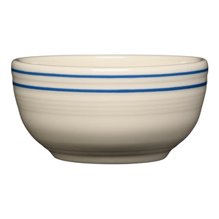 The Fiesta Americana Lapis Bands Set includes four 22 oz beige ceramic bistro coupe cereal bowls, each with two thin blue rims, inspired by the classic Lapis Band design and shown against a white background.