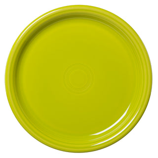 The Fiesta Retired Bistro Coupe 10 1/2 Inch Dinner Plate is a round, lime green, lead-safe china plate featuring subtle concentric circles in the center and a smooth, glossy finish.