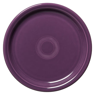 A round, deep purple Fiesta Retired Bistro Coupe 10 1/2 Inch Dinner Plate with circular ridges and a glossy finish, viewed from above. Made in the USA and lead-safe.