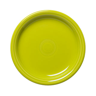 The Fiesta Retired Bistro Coupe 7 1/4 Inch Salad Plate in lemongrass features a round, glossy finish with concentric circle designs; made in the USA from lead-safe china.