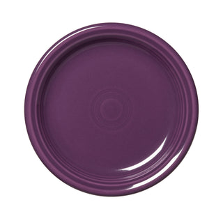 The Fiesta Retired Bistro Coupe 7 1/4 Inch Salad Plate in mulberry features a glossy, round design with concentric circles and is made in the USA, shown from above on a white background.