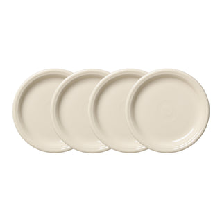Four Fiesta Linen Bistro Coupe 7 1/4 Inch Salad Plates are arranged in a horizontal row, slightly overlapping. Their cream surfaces display a subtle circular design at the center.