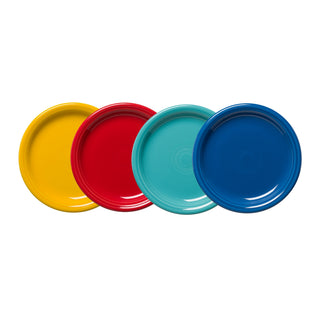 The Fiesta Mixed Vibrant Bistro Coupe 7 1/4 Inch Salad Plate Set of 4 features yellow, red, light blue, and dark blue plates arranged side by side, adding a lively touch to any table.