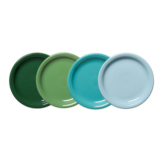 The Fiesta Mixed Aegean Bistro Coupe 7 1/4 Inch Salad Plate Set of 4 features four glossy plates in dark green, light green, turquoise, and light blue, each with Fiesta’s signature concentric circle design.