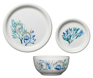 The Fiesta Retired Bistro Coupe 3-Piece Place Setting in Coastal Shores features a large plate, small plate, and bowl, each with blue, green, and gold floral and seashell designs—an updated take on classic bistro dinnerware.