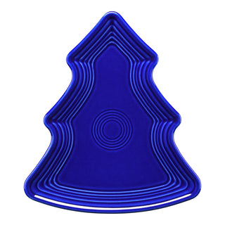 A Fiesta Retired Tree Shaped Plate in twilight blue, 10 1/8 inch, featuring concentric raised ridges and a circular central pattern, made in the USA, shown on a white background.