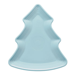 Pale blue ceramic plate shaped like a Christmas tree, featuring subtle ridged detailing and a smooth surface.