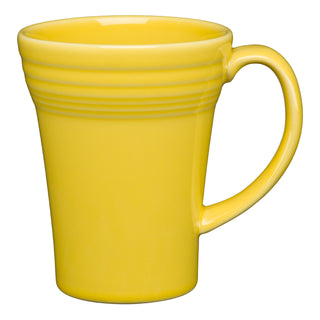 The Fiesta 18 OZ Bistro Latte Mug by Fiesta is a bright yellow ceramic mug made in the USA, featuring a large handle and subtle horizontal ridges near the top, shown against a plain white background.