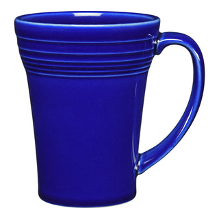 The Fiesta 18 OZ Bistro Latte Mug by Fiesta is a vibrant cobalt blue ceramic mug made in the USA, with a smooth finish, horizontal ridges near the rim, and a sturdy right-side handle, shown on a white background.