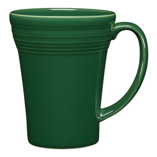 The Fiesta 18 OZ Bistro Latte Mug by Fiesta is a ceramic, dark green mug with a large handle and subtle horizontal ridges near the top, made in the USA and shown on a white background.