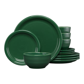The Fiesta Bistro Coupe 12-Piece Dinnerware Set in jade, service for 4, features modern plates and bowls stacked neatly together on a white background.