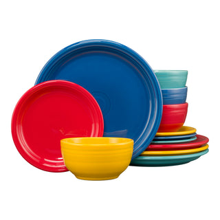 The Fiesta Mixed Vibrant Bistro Coupe 12-Piece Dinnerware Set, Service for 4, features colorful plates and bowls in red, blue, yellow, orange, and teal. This modern coupe set is dishwasher safe and displayed against a white background.