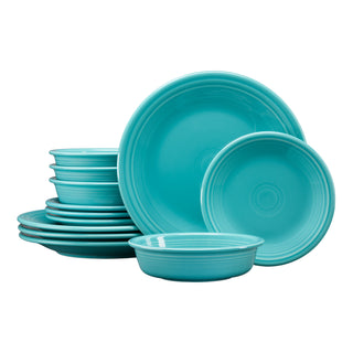 The Fiesta Classic Rim 12-Piece Dinnerware Set in turquoise, designed for 4, includes plates and bowls neatly stacked and arranged against a white background.