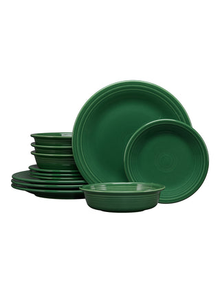 The Fiesta Classic Rim 12-Piece Dinnerware Set in jade features plates, bowls, and salad plates for four, each with a simple classic design and signature concentric circle detailing.