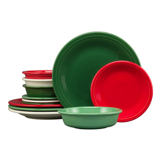 A festive stack of Fiesta's Christmas Mixed Color Classic Rim 12-Piece Dinnerware Set, Service for 4—featuring red, green, and white plates and bowls in a holiday-inspired palette. Made in the USA.