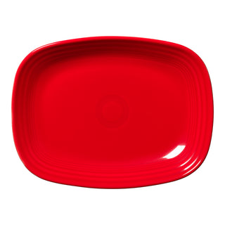 The Fiesta 12 Inch Large Rectangular Platter by Fiesta features a scarlet finish, rounded edges, and a central concentric circle pattern, displayed on a white background.