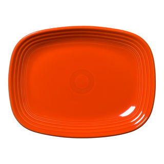 The Fiesta Retired 12 Inch Large Rectangular Platter in Poppy is a bright orange tray with a glossy finish, slightly rounded edges, and concentric raised lines near the rim.