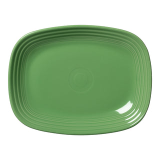 The Retired Fiesta 12 Inch Large Rectangular Platter by Fiesta is shown in Meadow green, featuring rounded edges and a subtle concentric circle pattern, displayed from above on a white background.