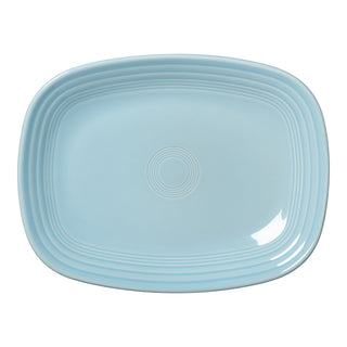 The Fiesta 12 Inch Large Rectangular Platter by Fiesta features a sky color, smooth ceramic surface, rounded corners, and concentric raised rings near the center and edges. Made in the USA.