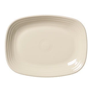 The Fiesta Linen 12 Inch Large Rectangular Platter features a cream-colored ceramic design with rounded edges and subtle concentric ridges near the center and rim.