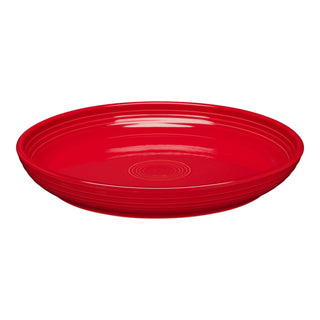 The Fiesta Coupe 10 3/8 Inch Dinner Bowl (40 OZ) in scarlet is a round ceramic bowl with a shallow depth, smooth glossy finish, and subtle concentric circles. Microwave safe for versatile use.