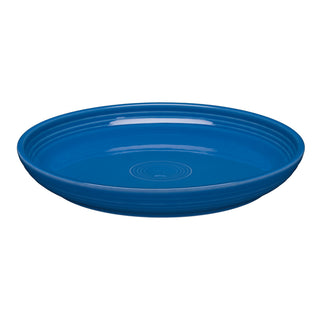The Fiesta Coupe 10 3/8 Inch Dinner Bowl (40 OZ) in lapis features a round shape, glossy finish, and subtle concentric circles on the center and rim; microwave safe for convenience.