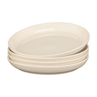 A neatly arranged stack of four cream-colored Fiesta Linen Set of 4 Coupe 10 3/8 Inch Dinner Bowl 40 OZ plates with slightly raised edges sits on a white background.